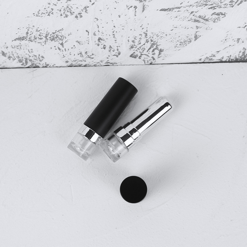 Jinze round shape matte black transparent bottom lipstick tube lip balm container 