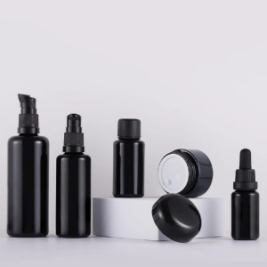 black luxurious round shape glass lotion bottle and glass cream jar for cosmetic products