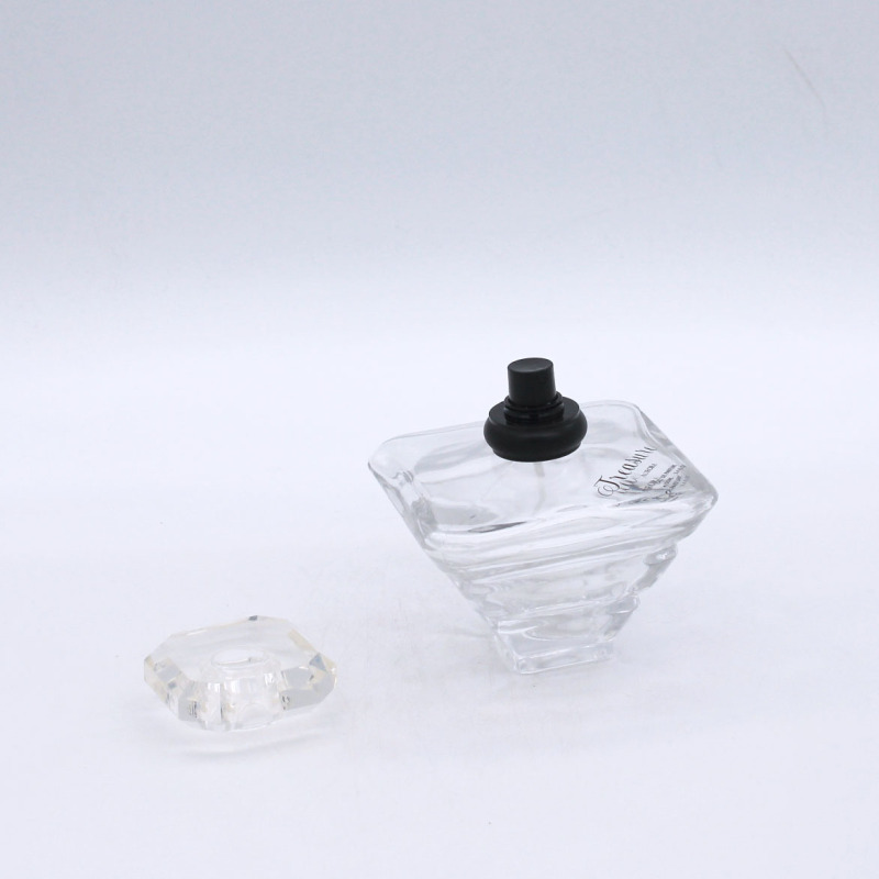 design fancy shaped 100ml clear cosmetic spray perfume glass bottle supplier
