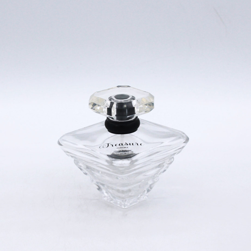 design fancy shaped 100ml clear cosmetic spray perfume glass bottle supplier