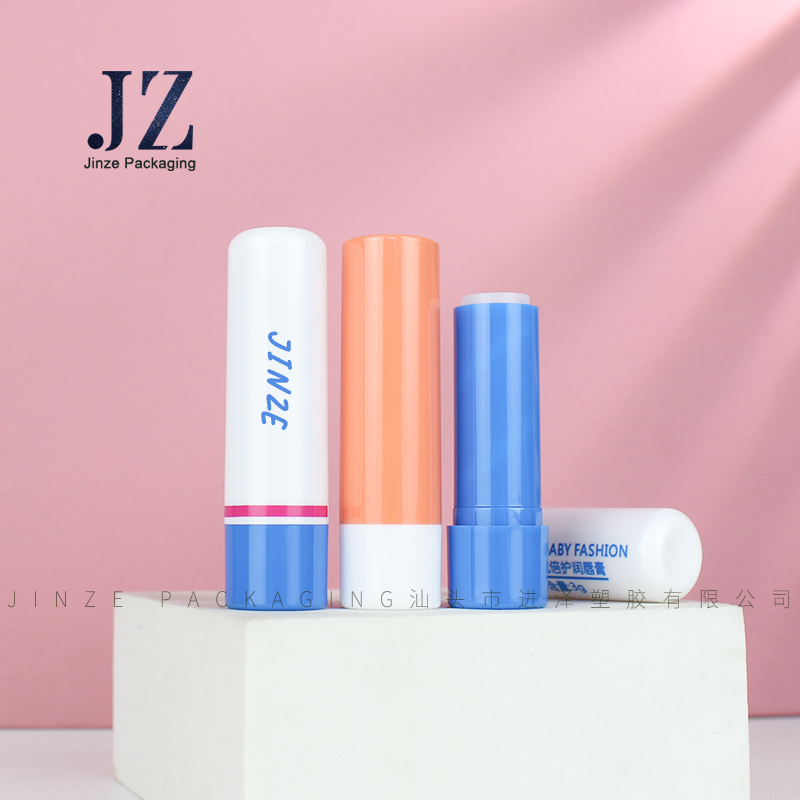 Jinze round shape custom color empty moisturizing base lip care tube baby lip balm container