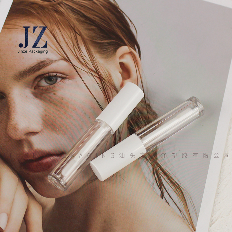 Jinze 2.5 ml mini capacity round lip gloss packaging empty cosmetic tube with silicone brush