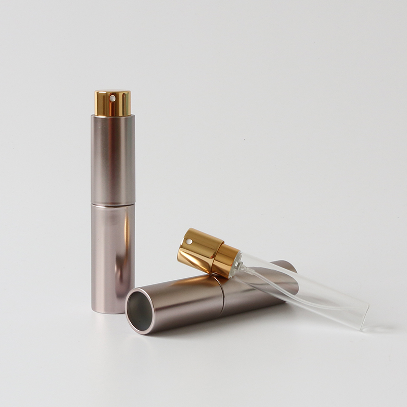 Wholesale glossy gold twist up refillable perfume atomizer travel 10ml spray bottle for oral spray